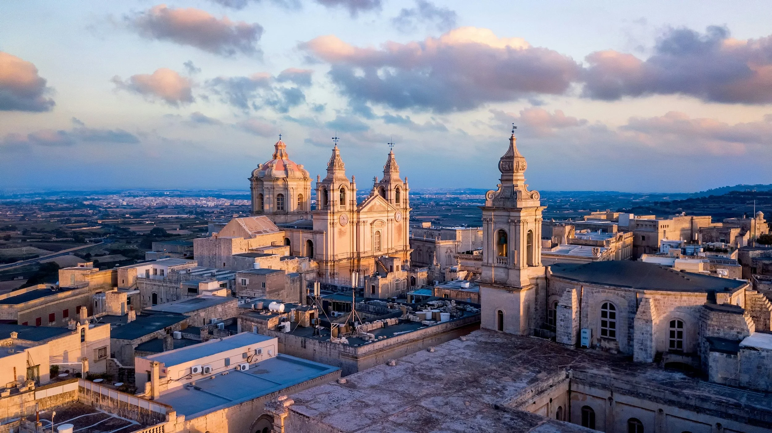 Mdina — silent limestone streets at dusk or the cathedral dome