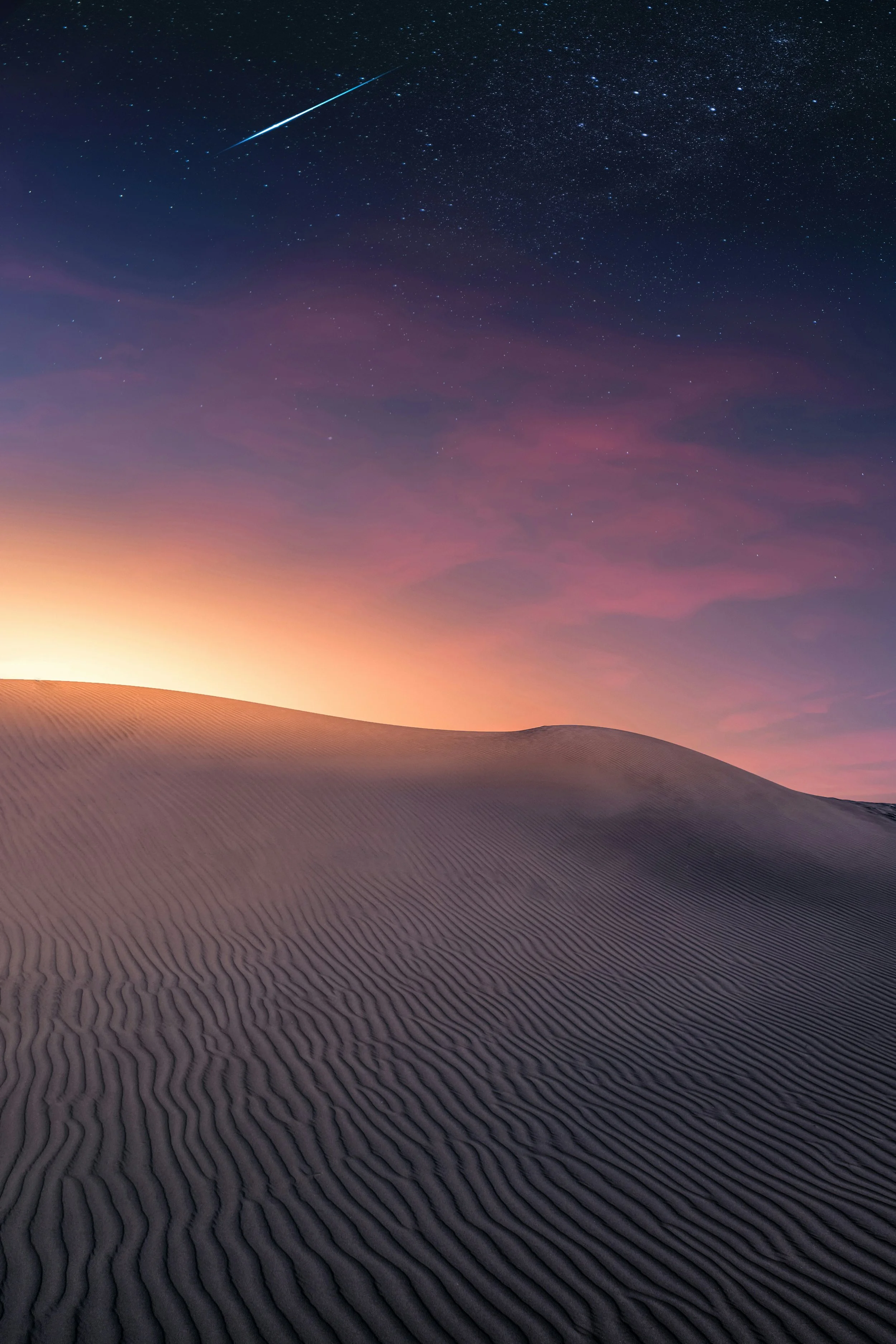 Sahara dunes at twilight with shooting star