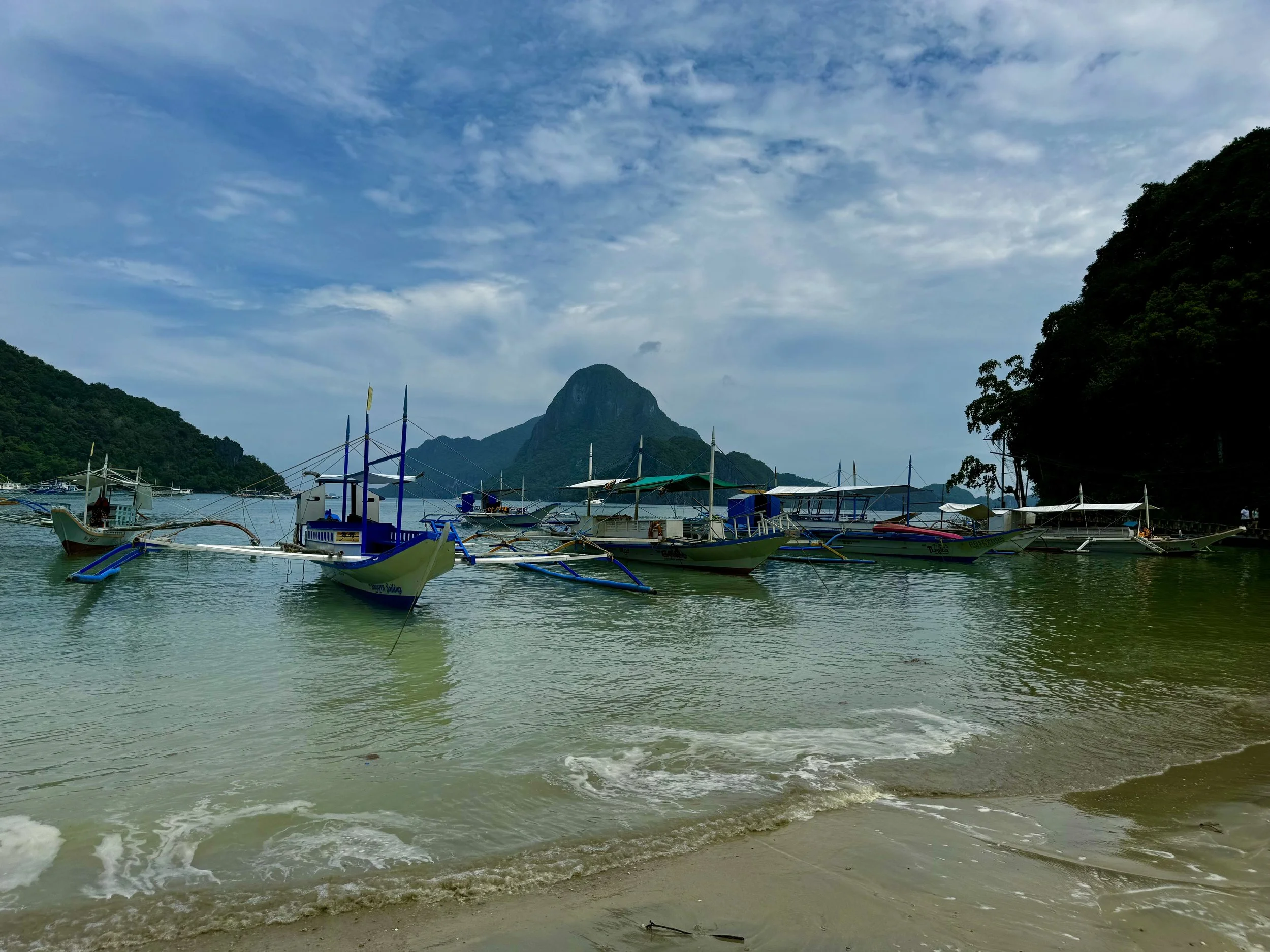 Philippines — jeepney street scene or banka boat on turquoise water