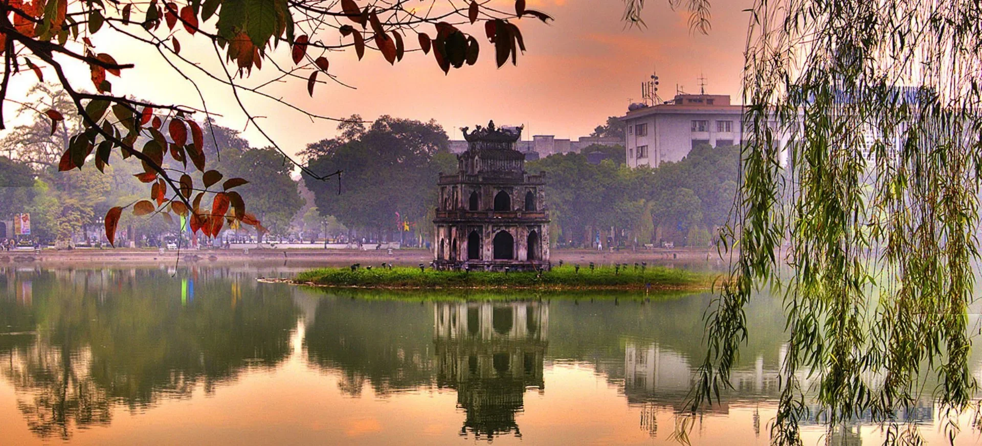 Hanoi — Hoan Kiem Lake at dawn or Old Quarter at dusk
