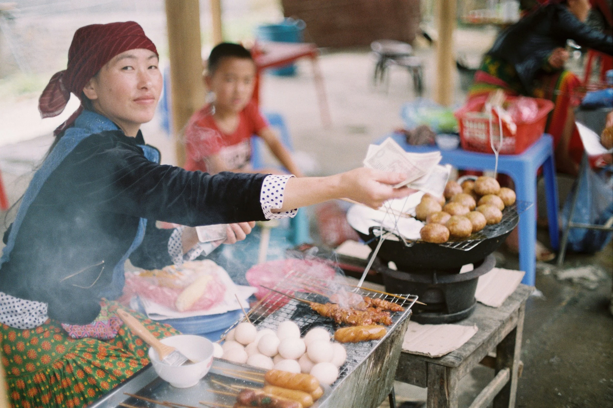 Vietnam travel — pho at a street stall or cyclo on a Hanoi street