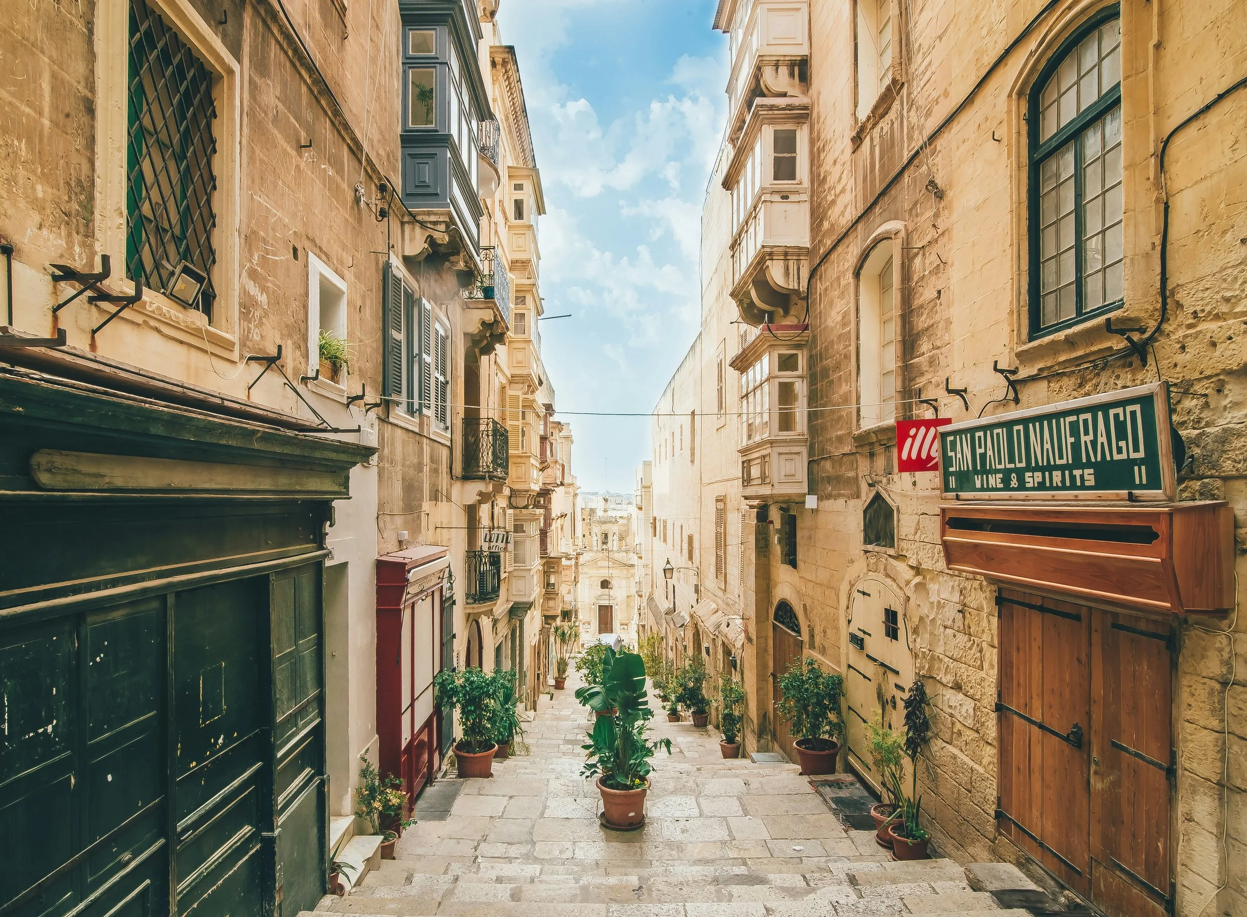 Malta travel — limestone balconies, festa fireworks, or village square