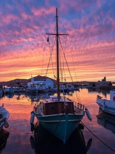 Paros — Naoussa harbour at sunset or whitewashed Lefkes village