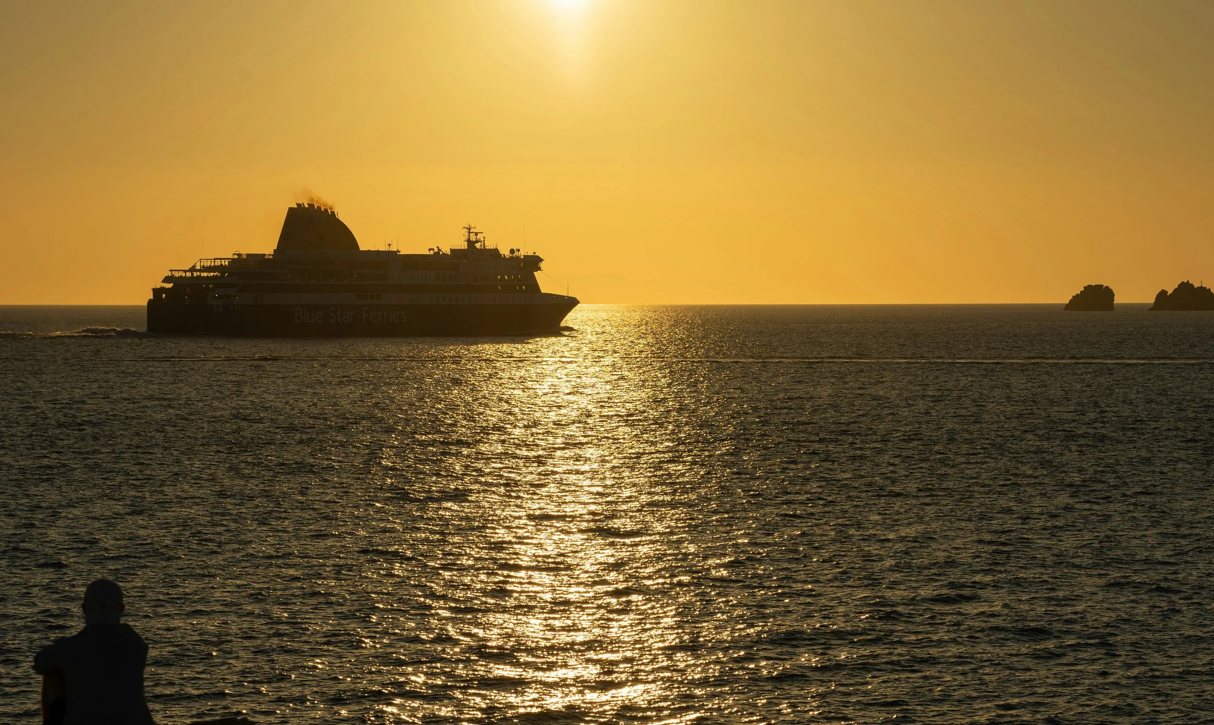 Greece travel — ferry on the Aegean or Greek taverna table