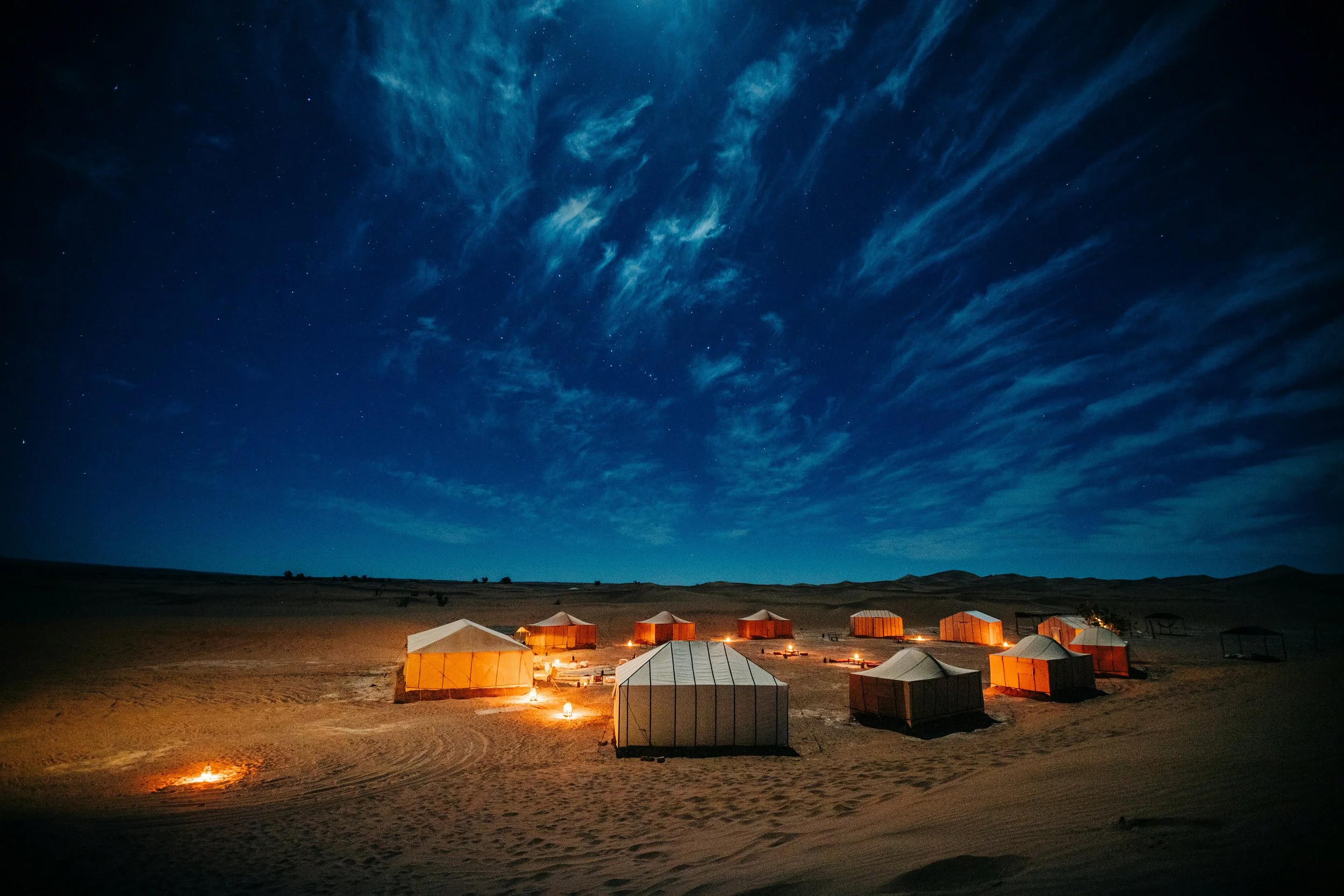 Desert glamping camp at night