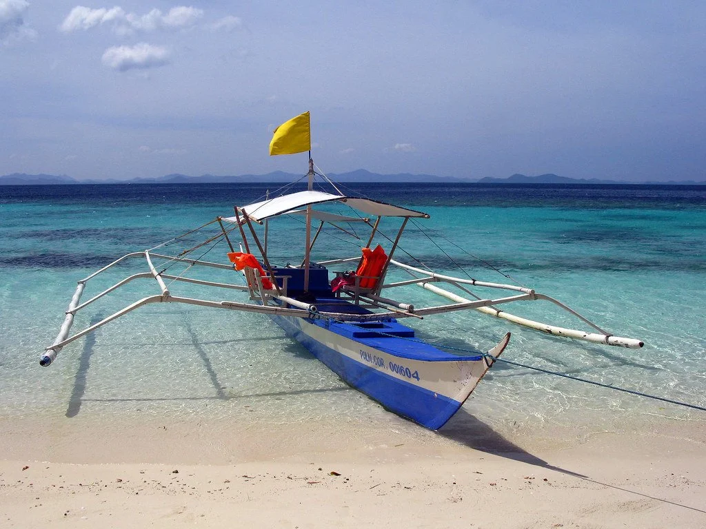 Philippines travel scene — inter-island ferry or a table of Filipino food