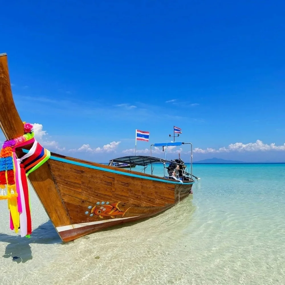 Thailand — monks at a temple or a longtail boat on emerald water