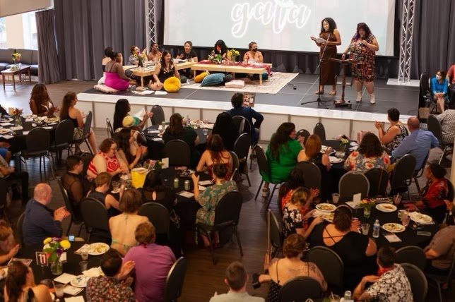 A large group of people at their tables listening to Gala event speakers