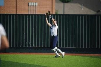Kate Seaton catching a fly ball