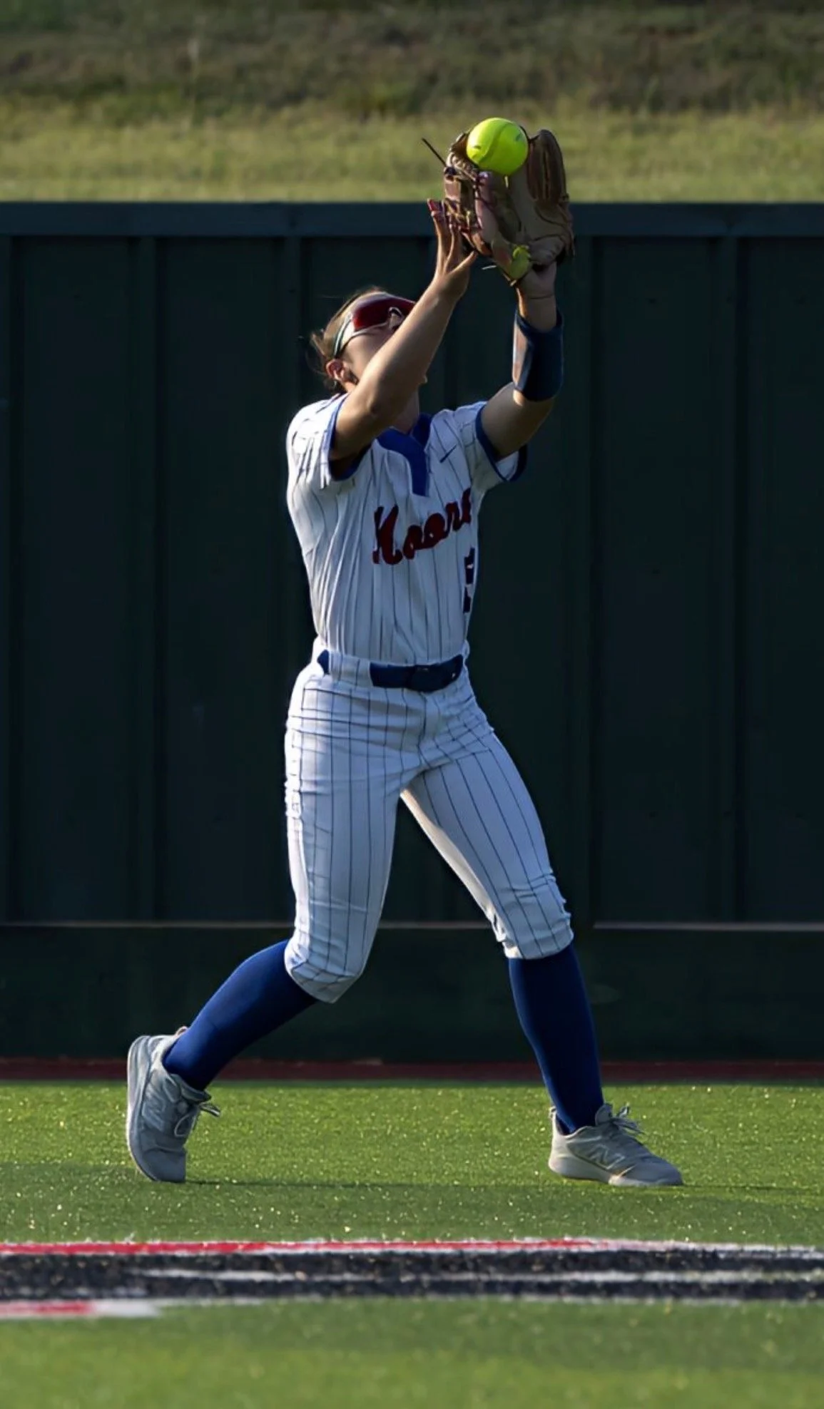 Payton Detweiler catching a fly ball