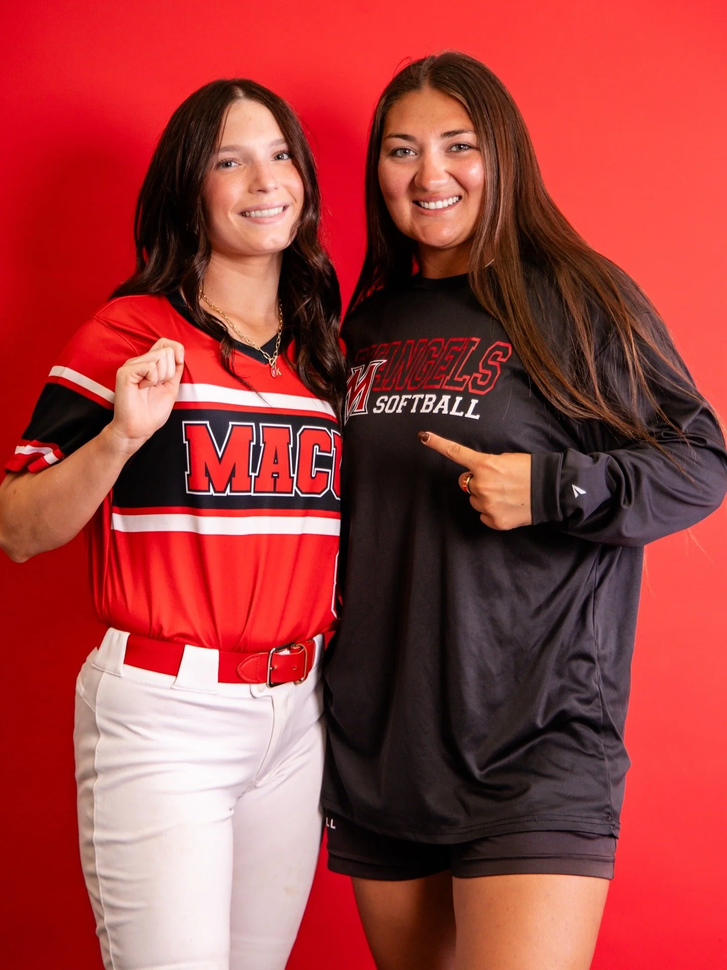 Kate Seaton posing with a MACU softball representative