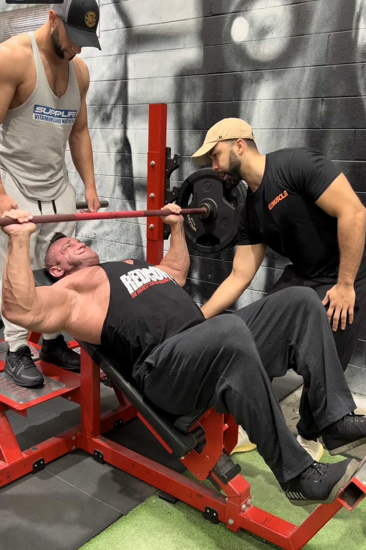 AEW athlete Brian Cage performing incline press coached by Anthony Nitti