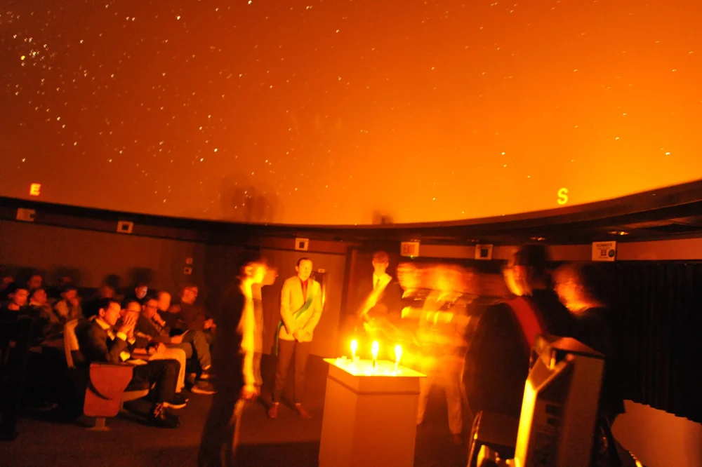 In nearly complete darkness, the Anderson Hancock Planetarium became The Hall of Iris as the Undergraduate Delts performed the Rite of Iris.