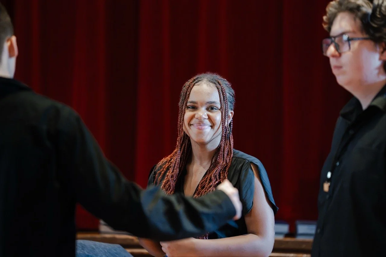 Choral Ascend 2025 — singer smiles on break