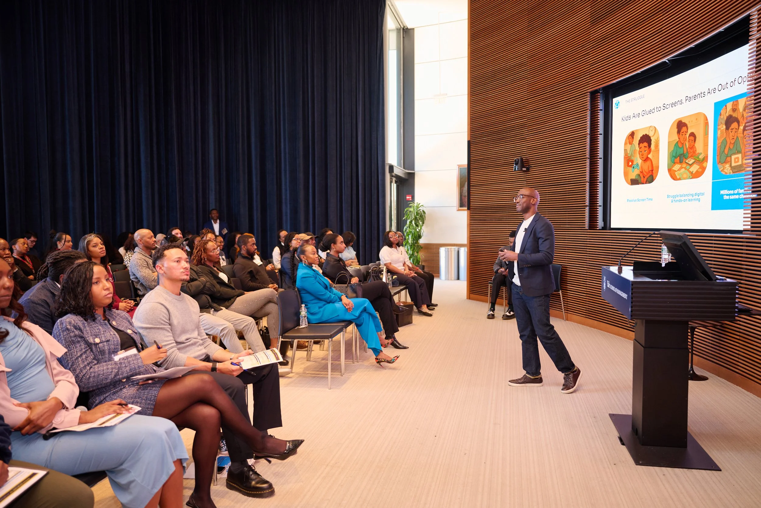 Audience listening to a summit speaker