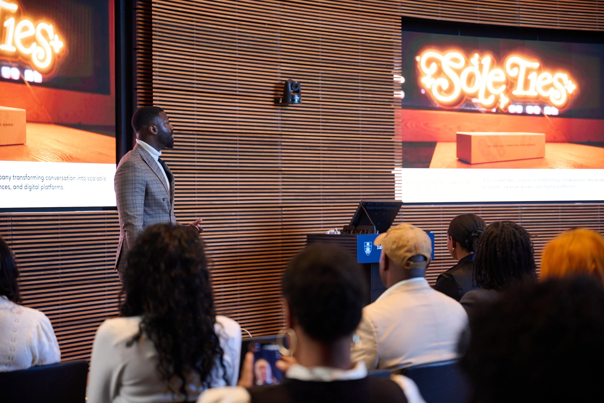 Founder presenting to summit attendees
