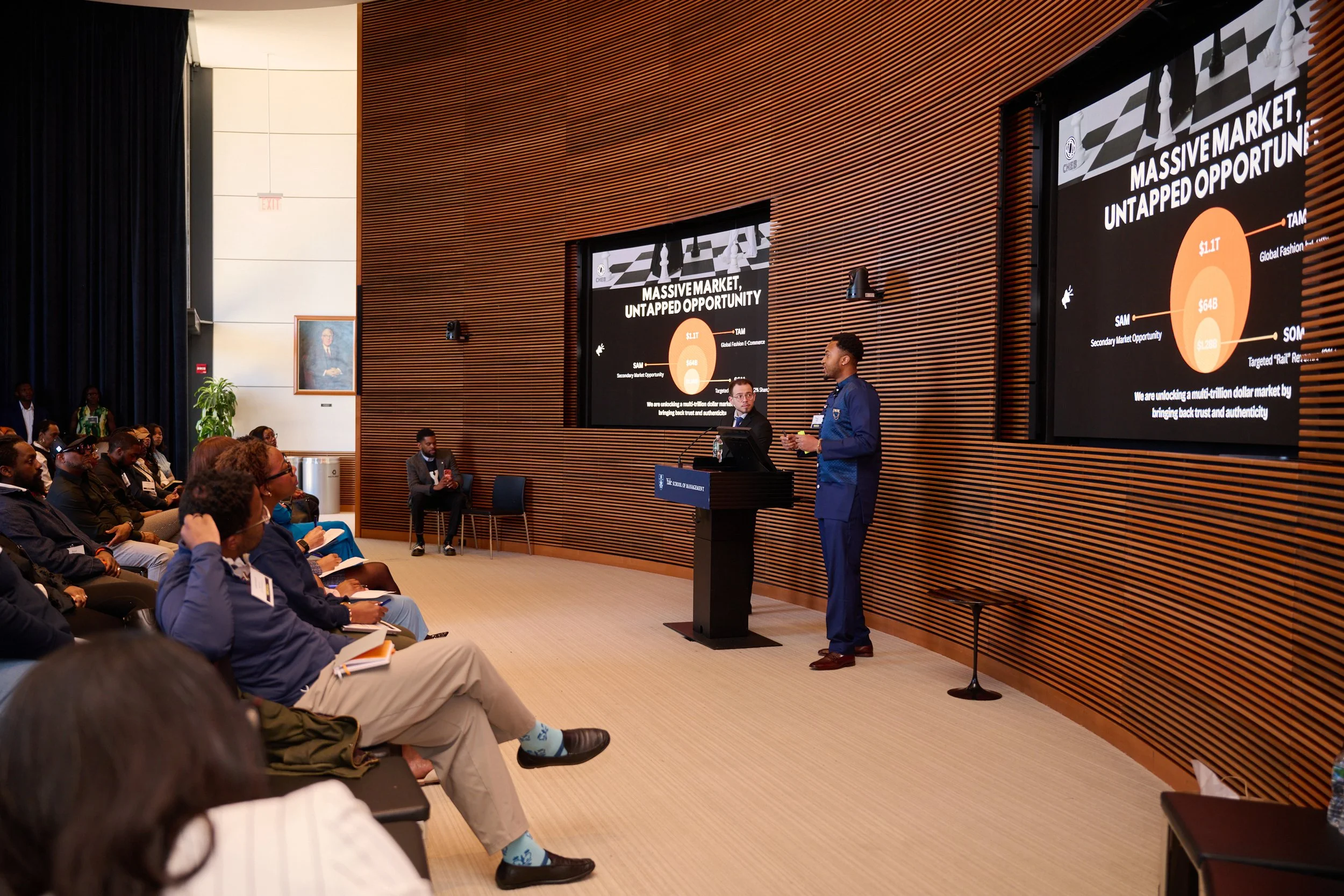 Speaker presenting an idea to the summit audience