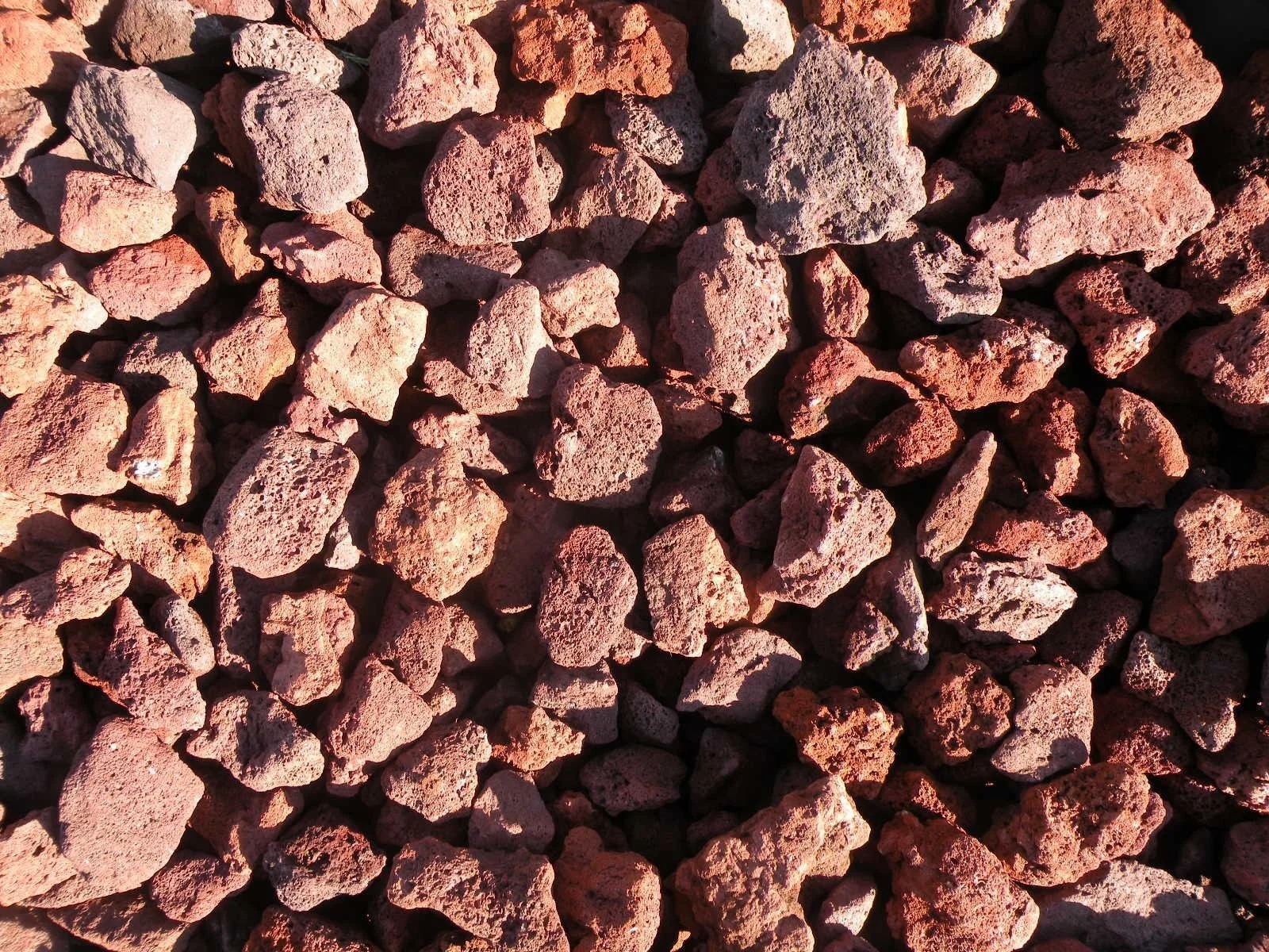 Red lava rock landscaping — Madison WI