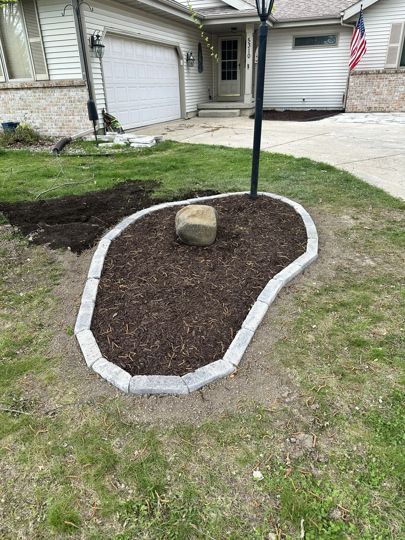 Stone edging installation in Bishops Bay, Middleton WI by YD Exterior Visions