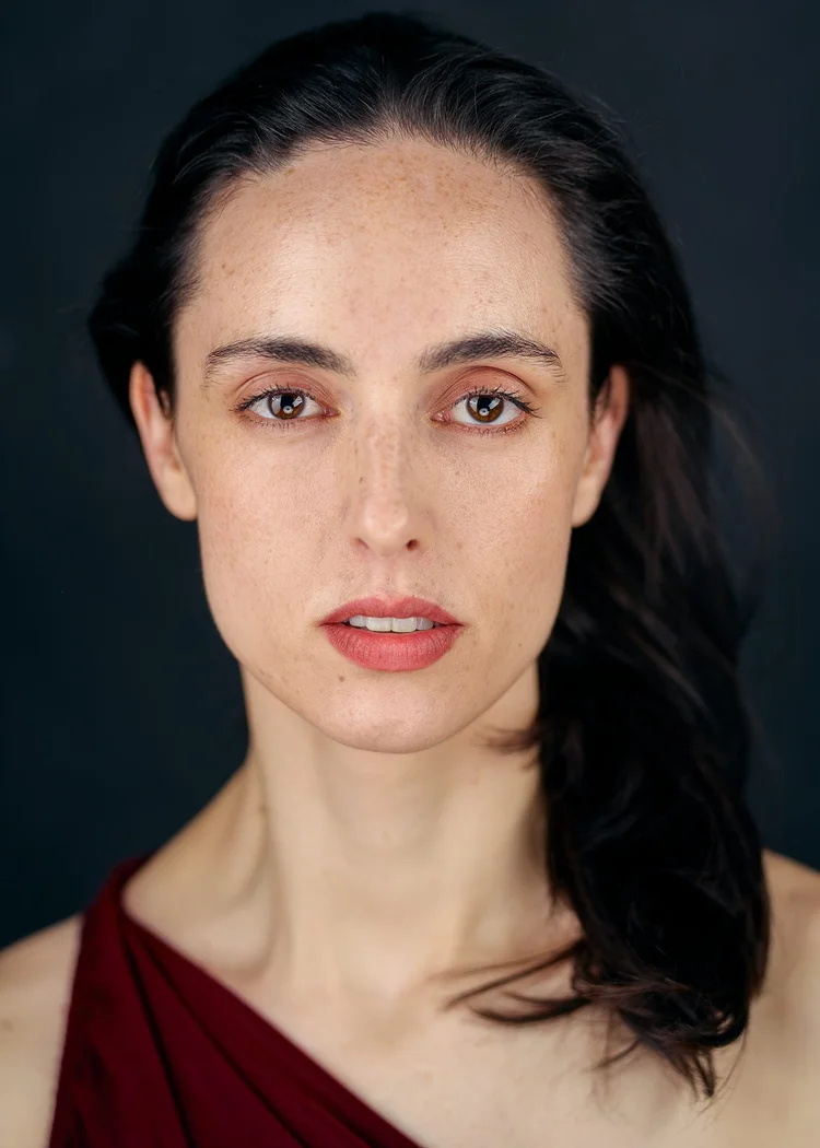 Close-up actor headshot with quiet, direct expression, New York City