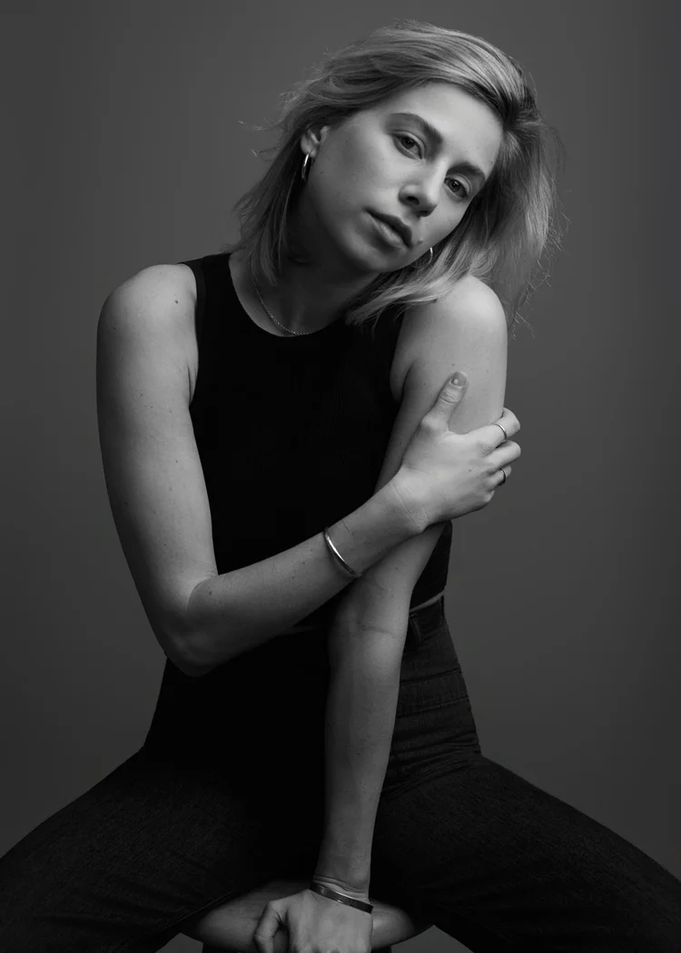 Black and white actor portrait of a woman in a black tank top, soft studio lighting
