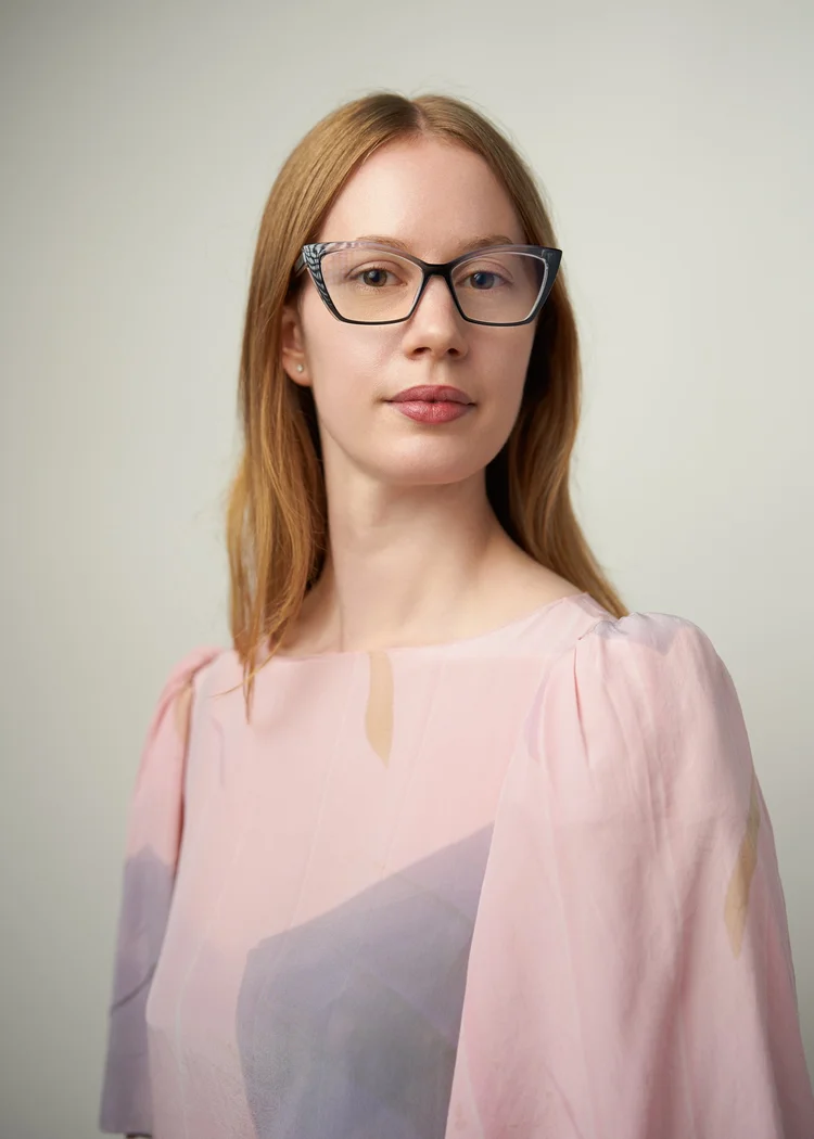 Commercial actor headshot with a pink backdrop, bright and approachable, NYC