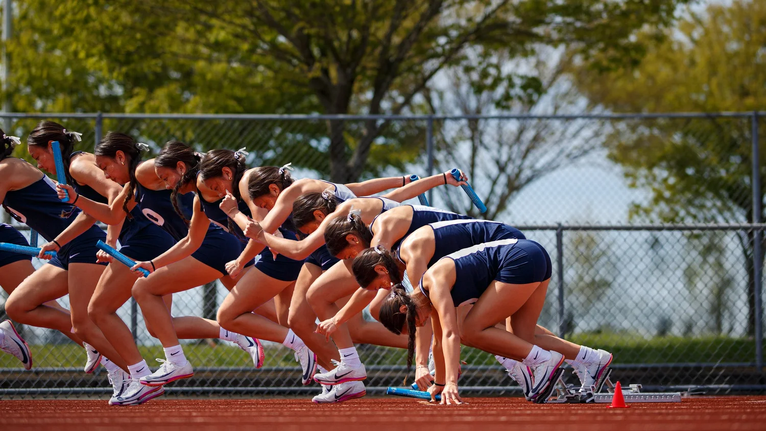 Sprinter Mika Meconi driving out of the starting blocks, captured as a motion sequence
