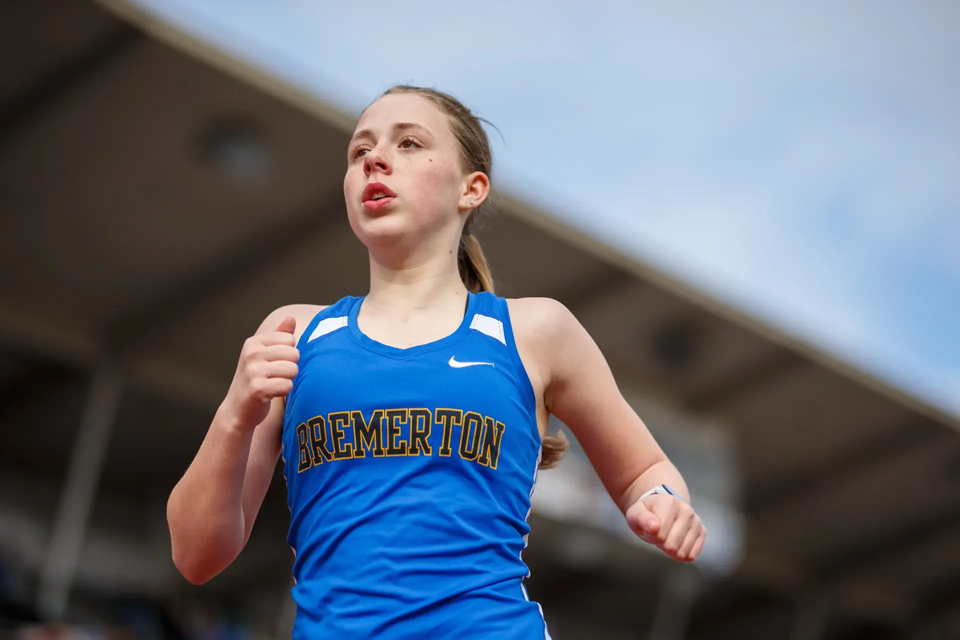Bremerton High School female track athlete focused during the 1600m race.