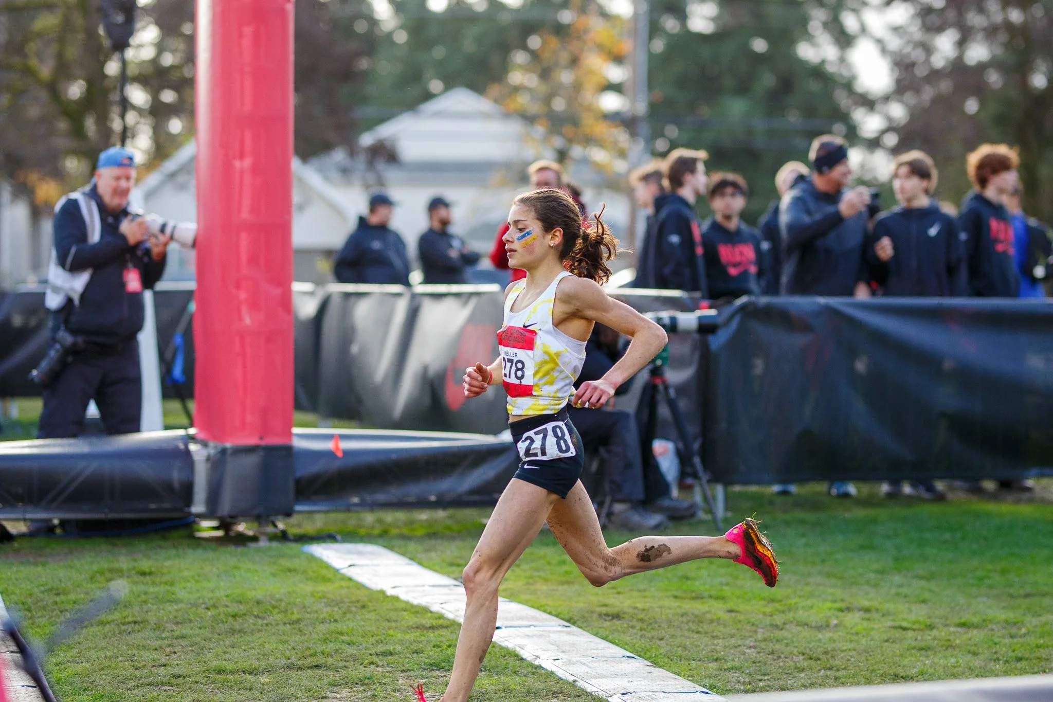 Spectators and coaches lining the course to cheer on runners at the NXN 2025 cross country meet at Glendoveer Golf Course.