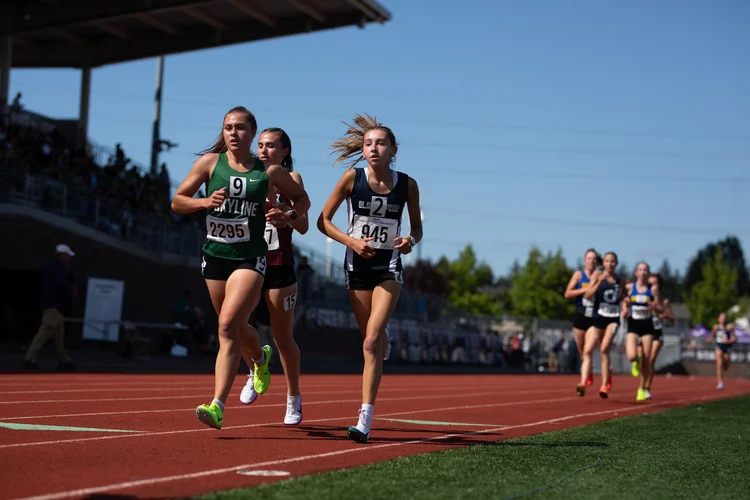 Lucy Fraser and Jaya Holt racing the 1600m at the 2025 WIAA State Track and Field Championships