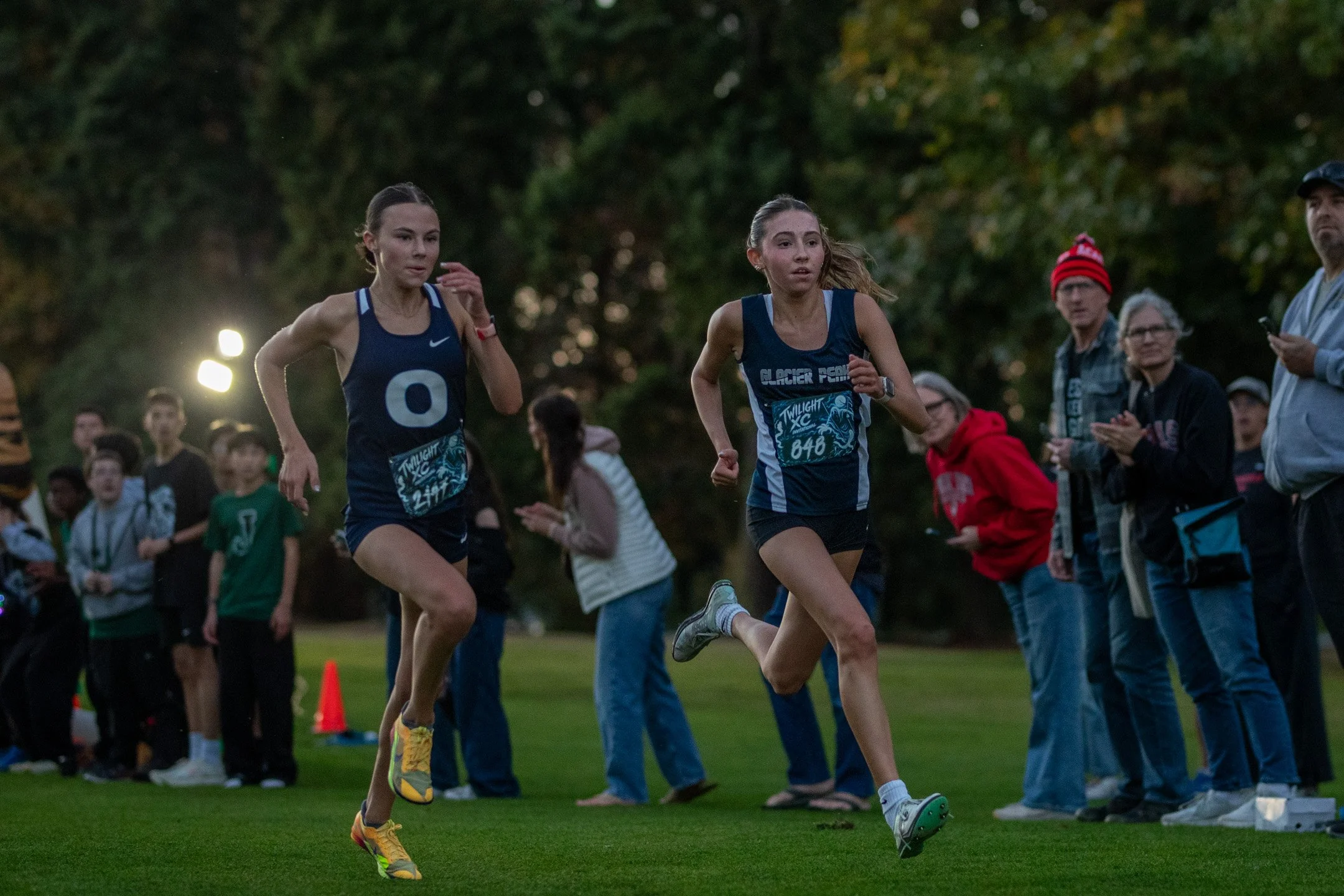 Jaya Holt of Glacier Peak and Leah Hennen of Olympia dead-heating the photo finish at the 2026 Nike Twilight Invitational, Legion Memorial Golf Course, Everett, Washington