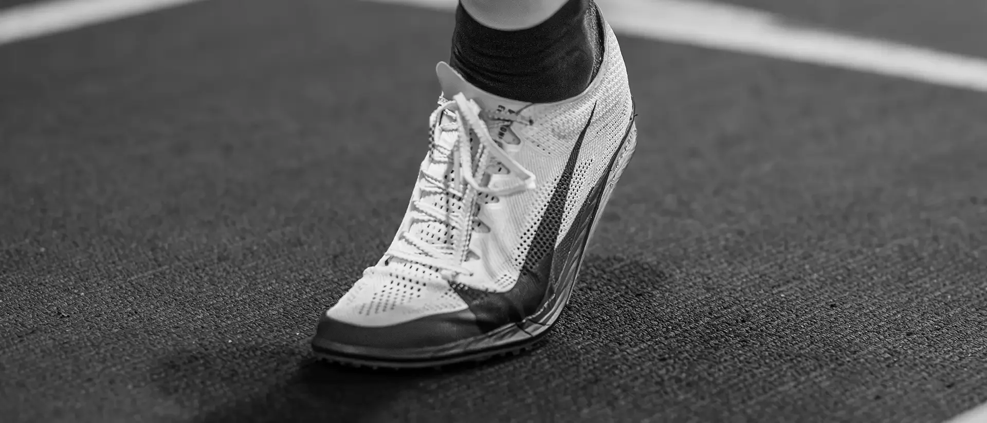 Track spike action detail indoor track meet