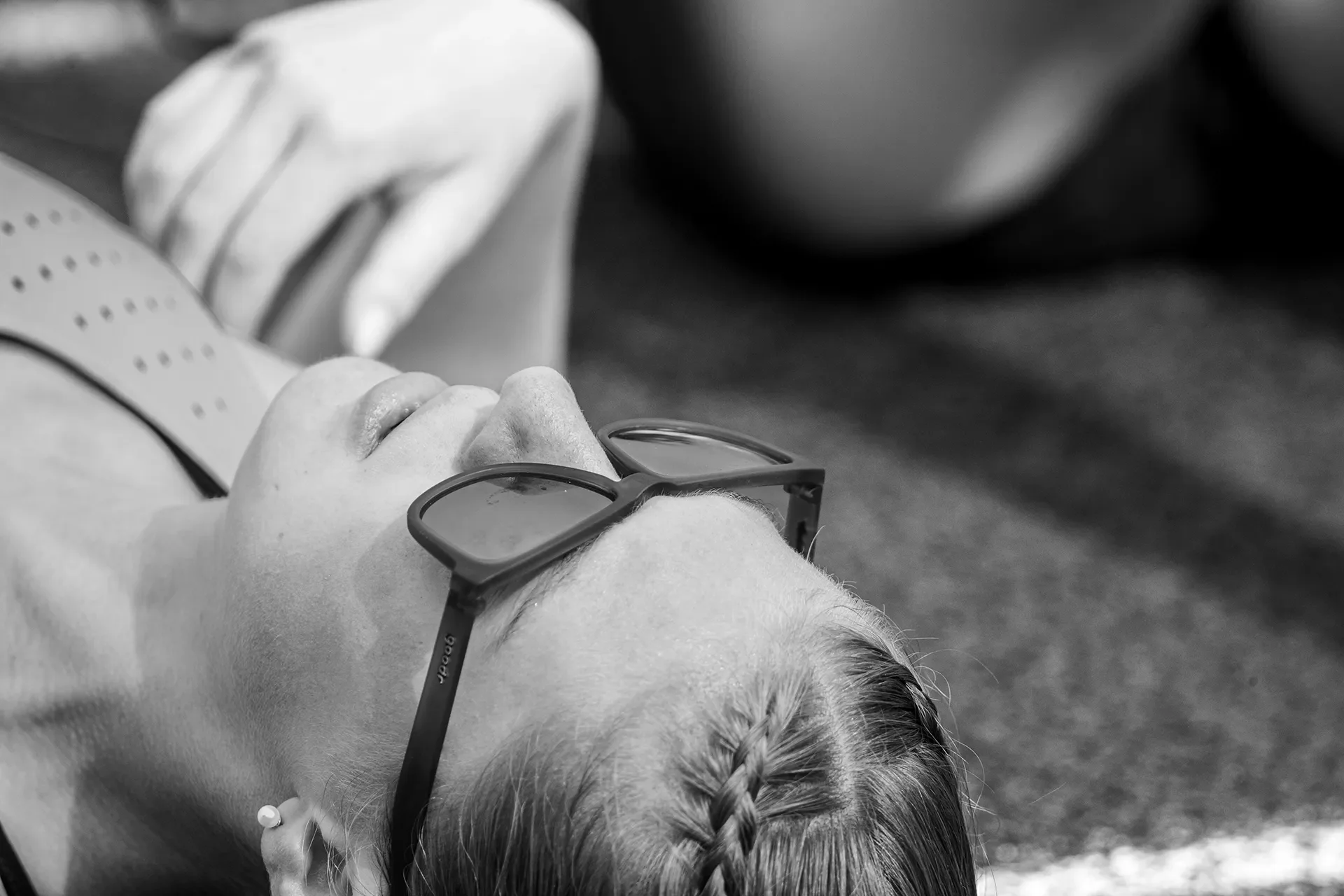 A runner in a quiet moment after the race, from the black-and-white visual essay
