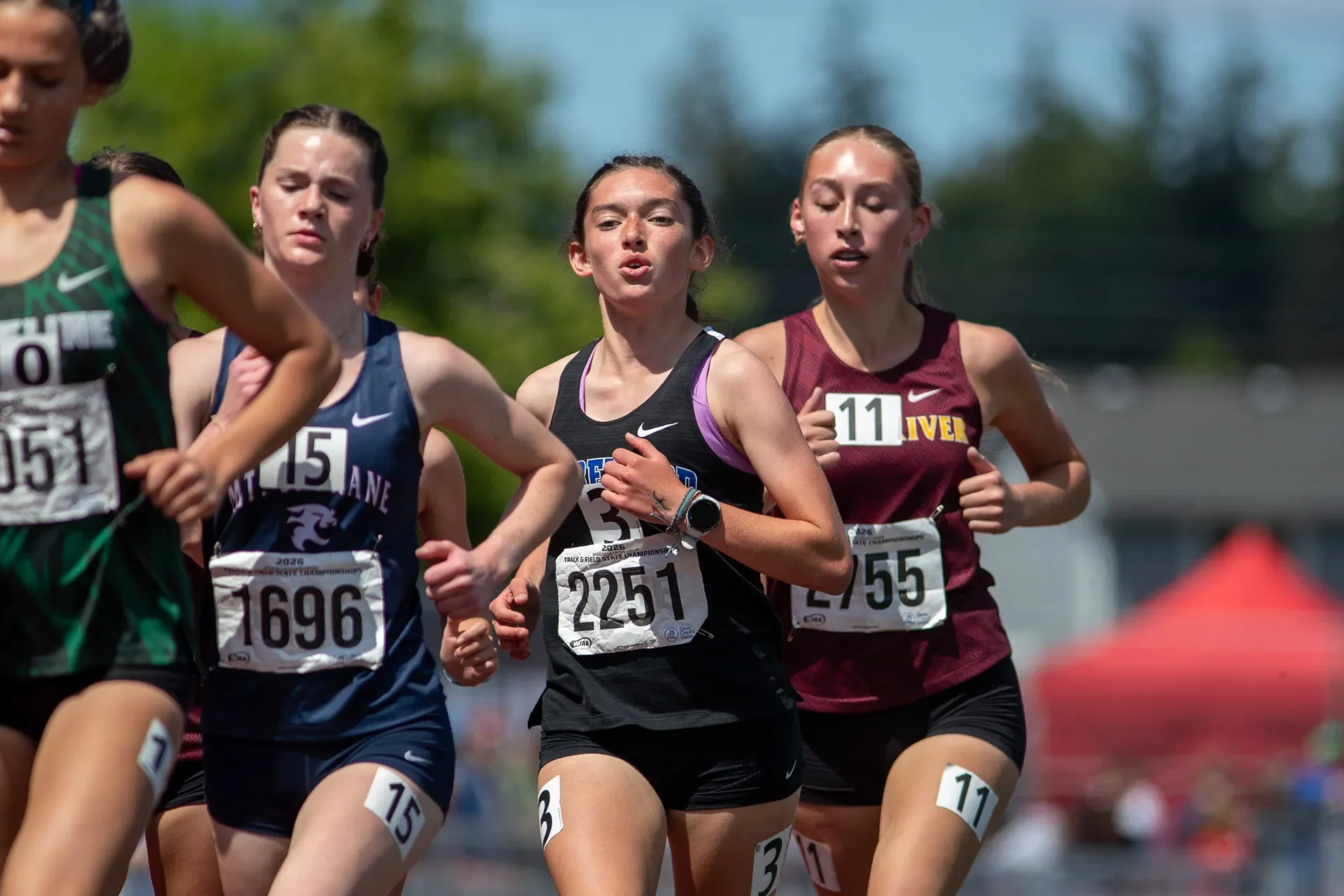 Olivia Decker running the 1600m for Shorewood High School at WIAA State - Frame 8