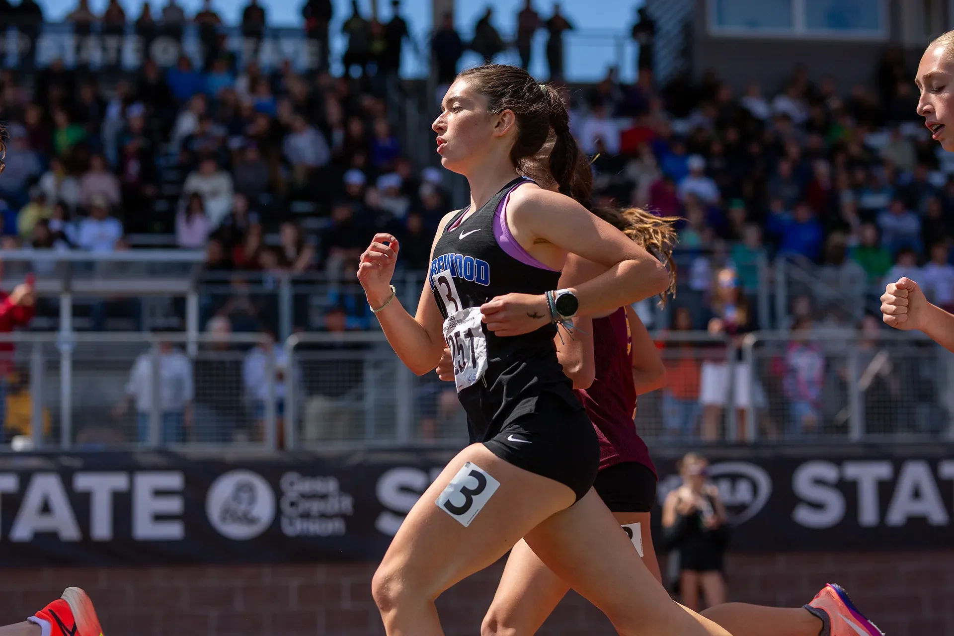 Olivia Decker running the 1600m for Shorewood High School at WIAA State Championships