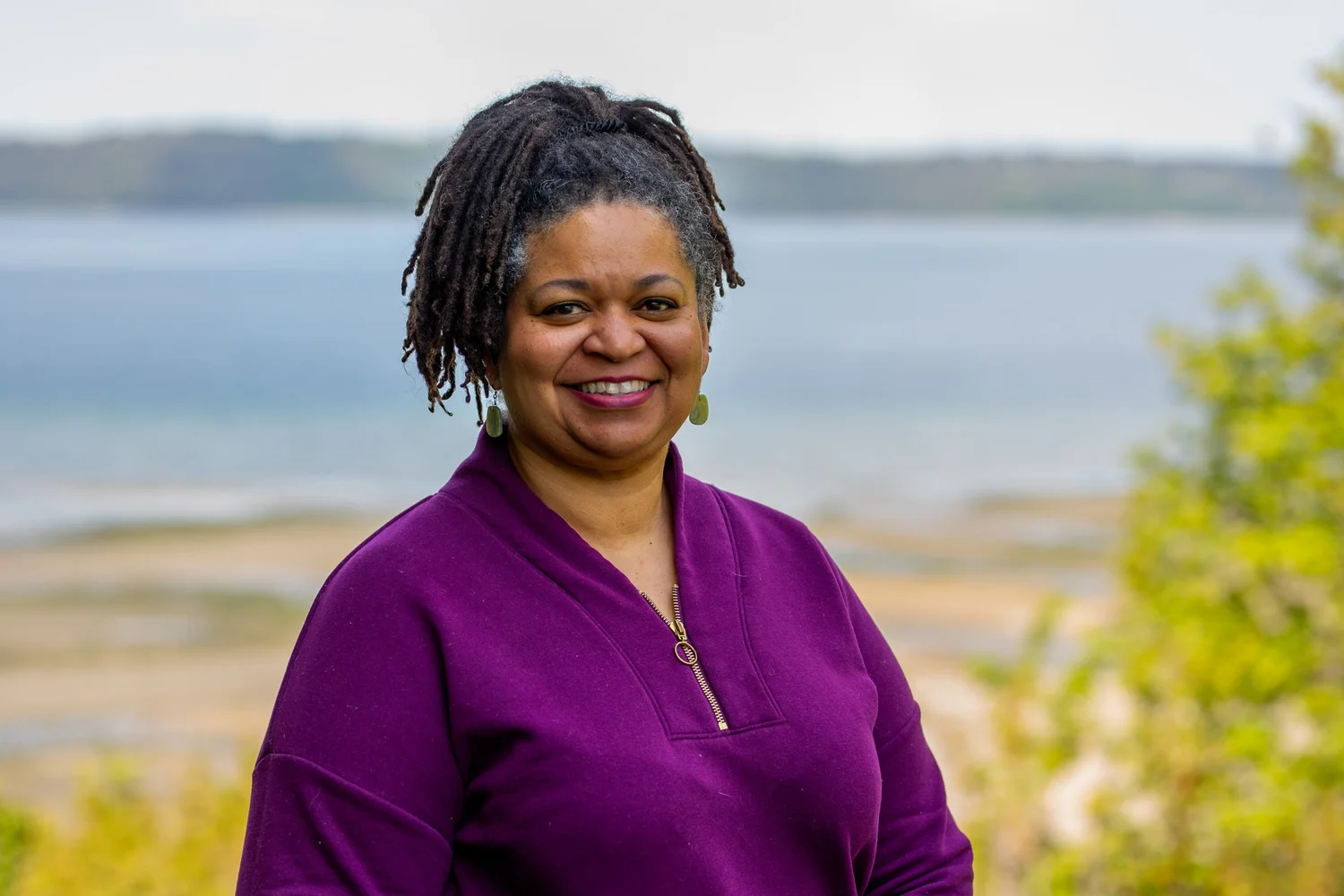 Standing headshot photographed against open sky for NW Education Access