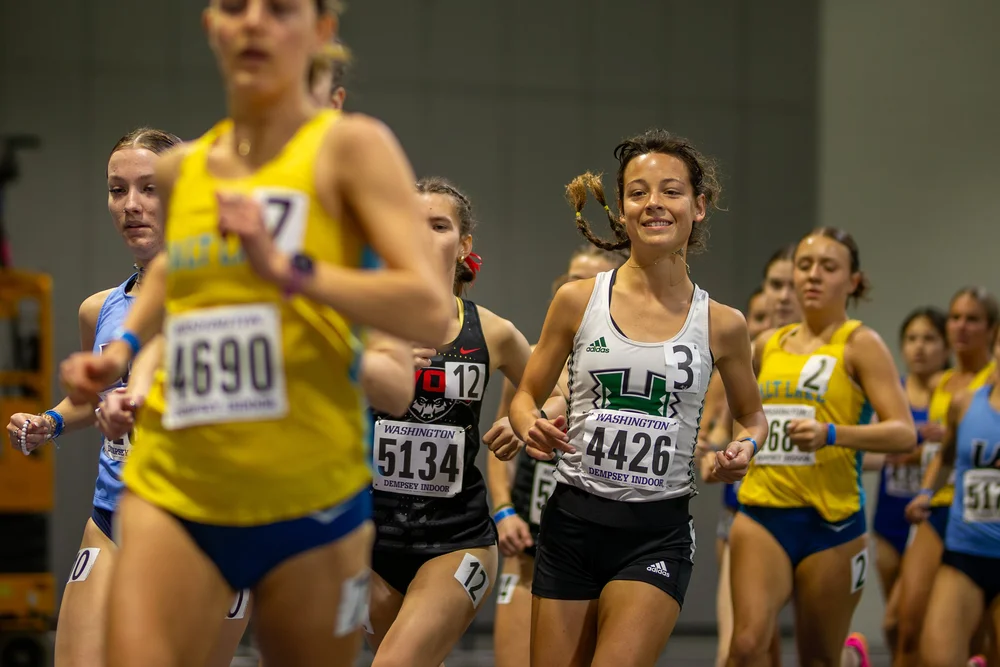 Distance runners racing indoors at the UW Invitational, Seattle WA