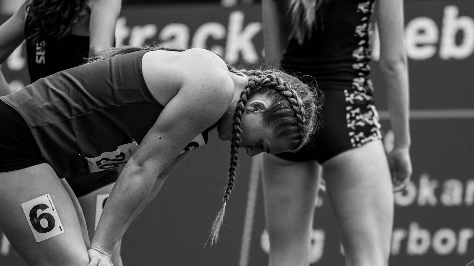 A competitor catches their breath in recovery after a distance race at the 2026 WIAA State Track Championships