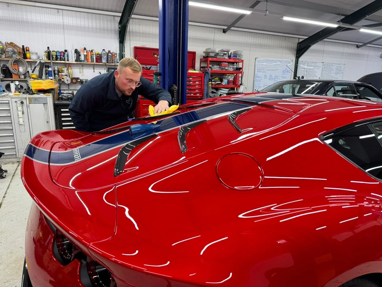 Harry hand-finishing Paul's Ferrari 812 Competizione