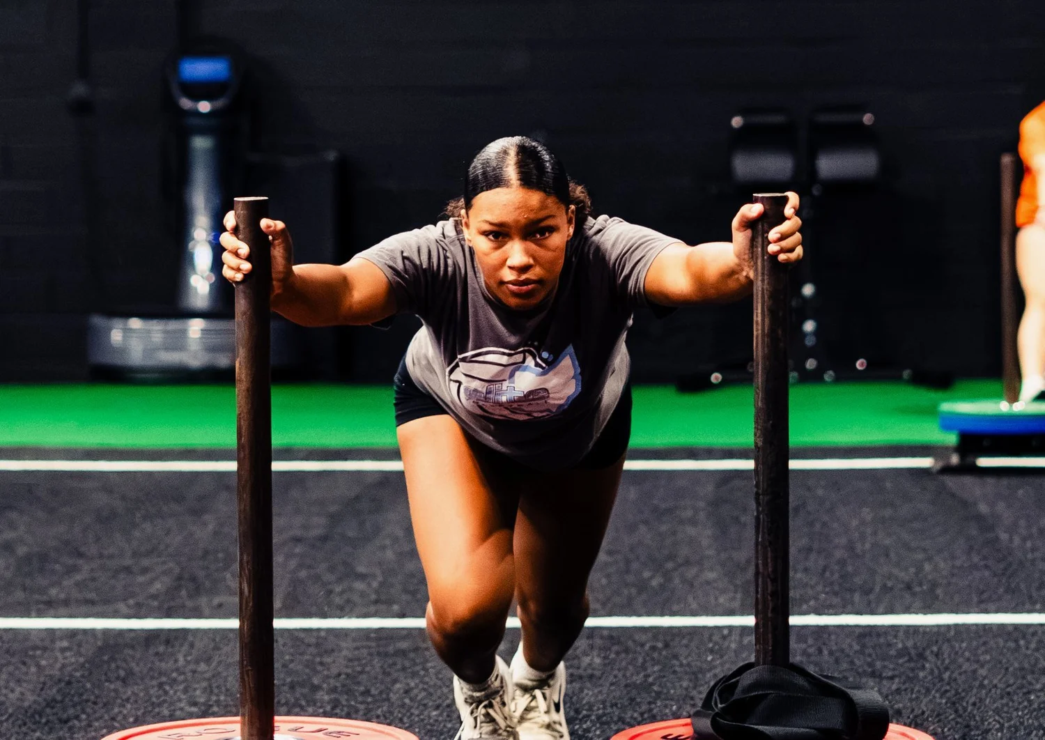 Athlete pushing a sled at Warehouse Performance