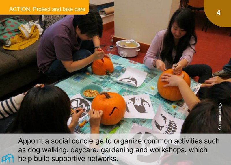 Photograph of two people carving pumpkins, suggesting community engagement activities