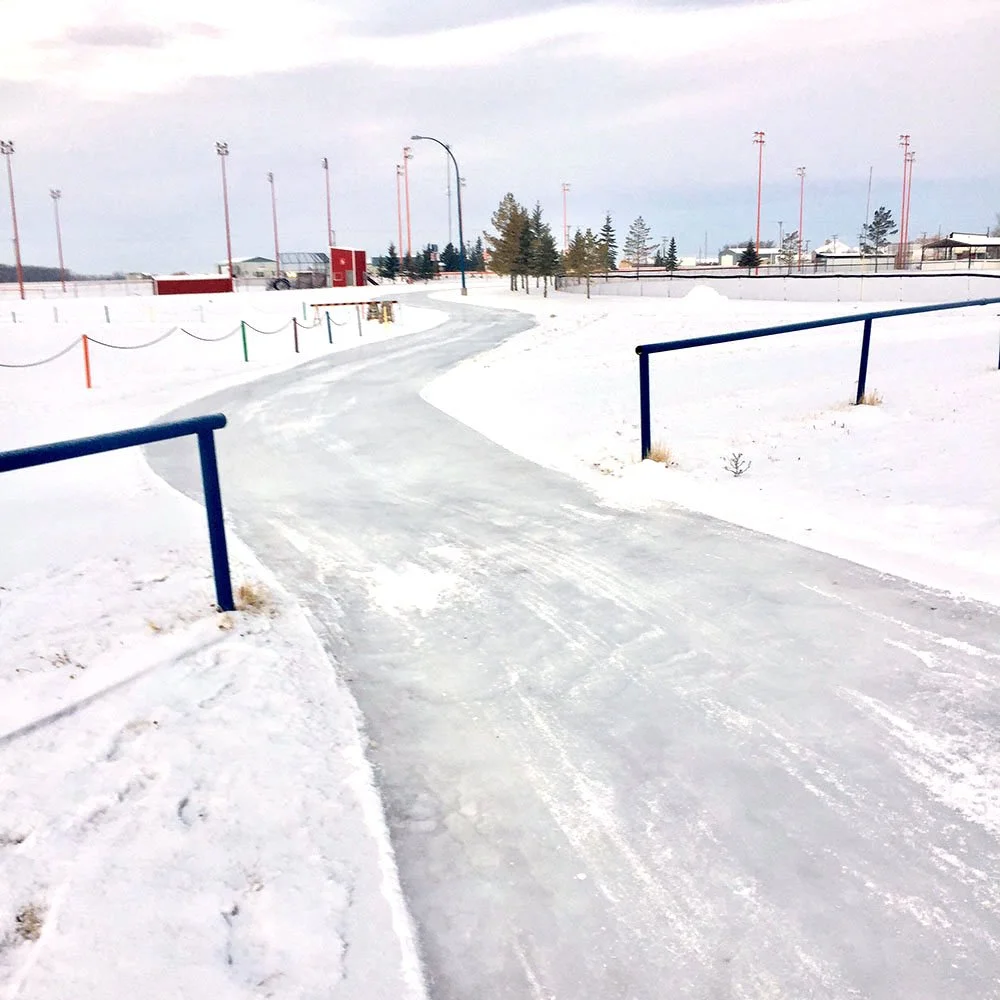A winding trail that has ice on it.