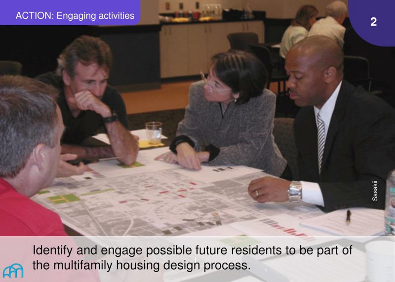 Action: Diverse group of people examining maps and documents during a planning session.