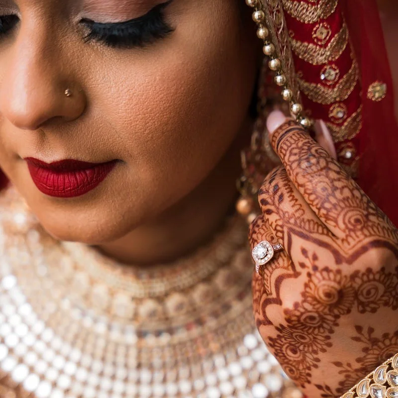 Punjabi wedding detail — closeup portrait of bride showing diamond ring