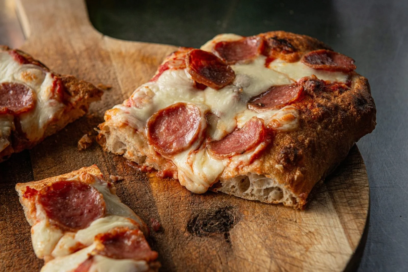 Pinsa with salami and melted mozzarella