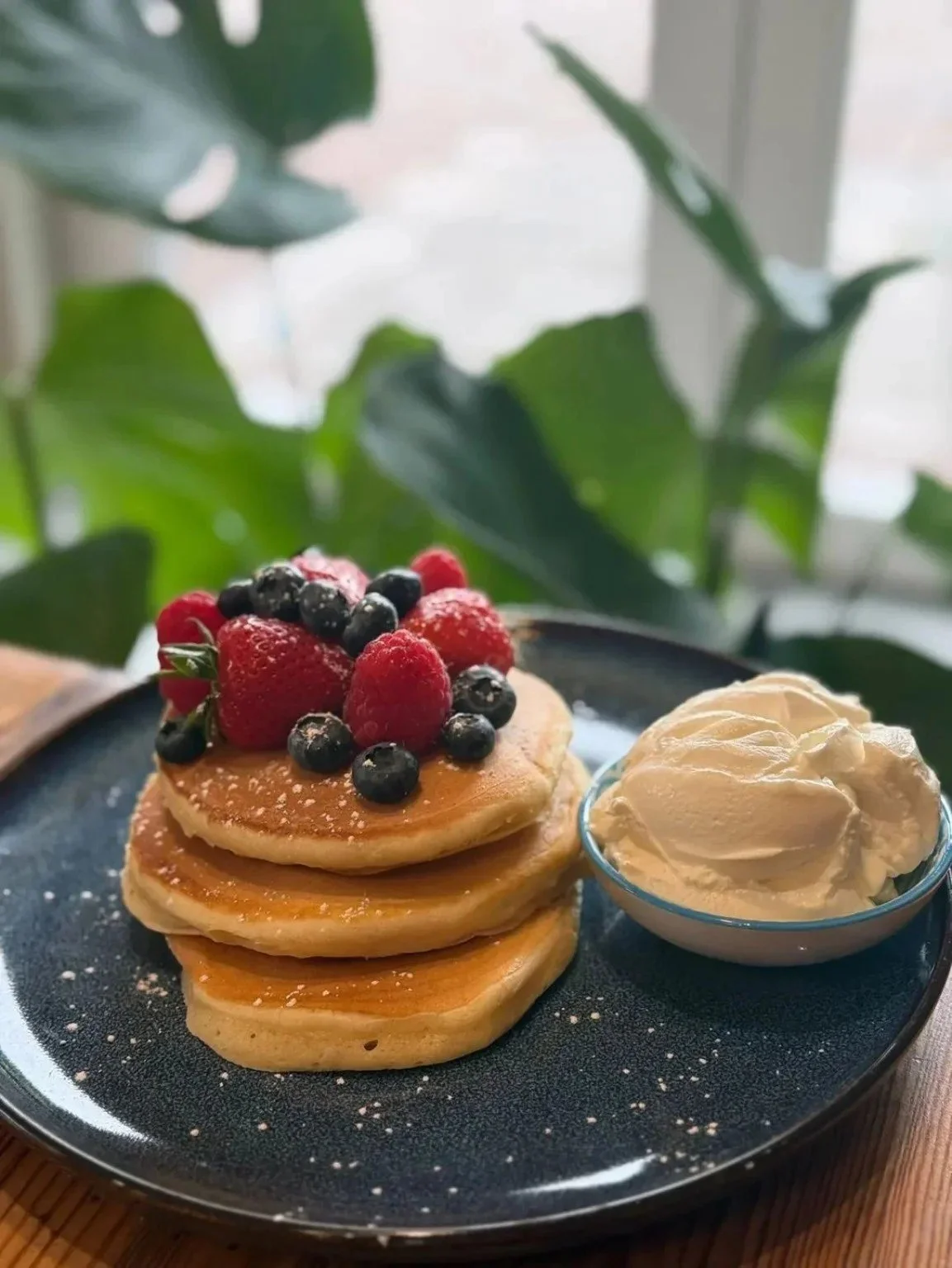 Pancakes with berries and cream