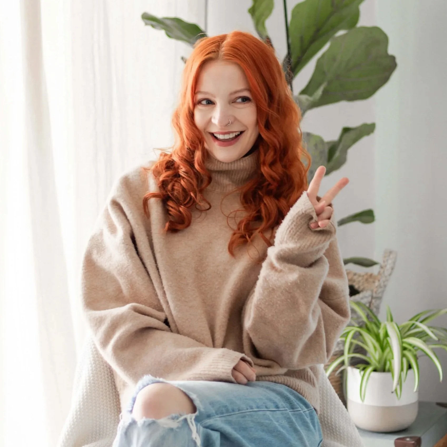 Derby graphic designer Rubie sat down, saying peace sign with her fingers.