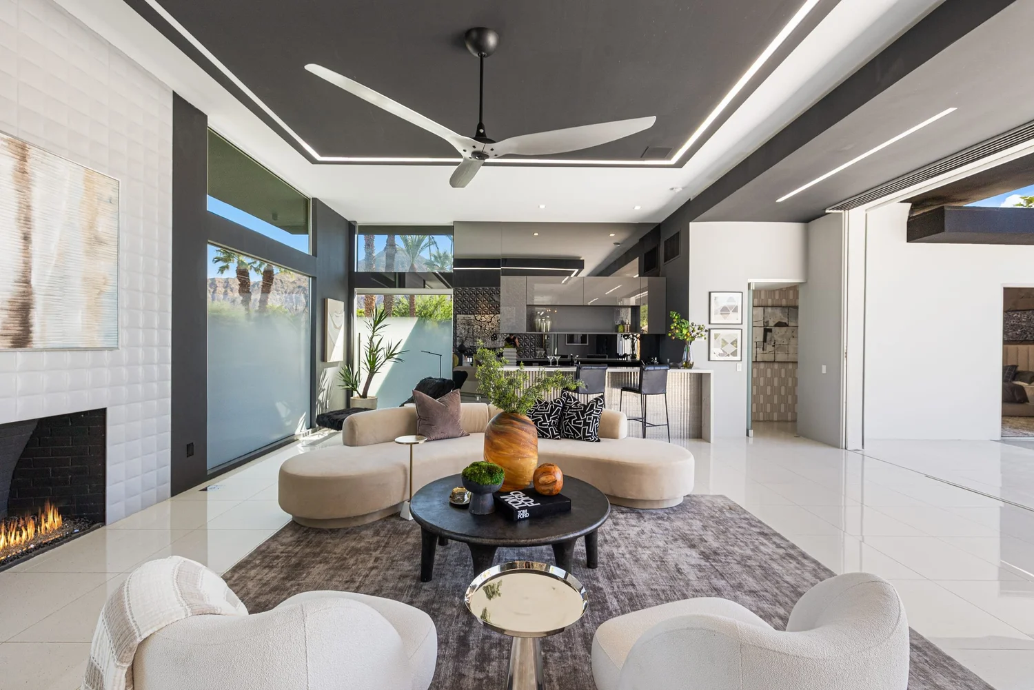 A furnished living room opening to a pool in Indian Wells