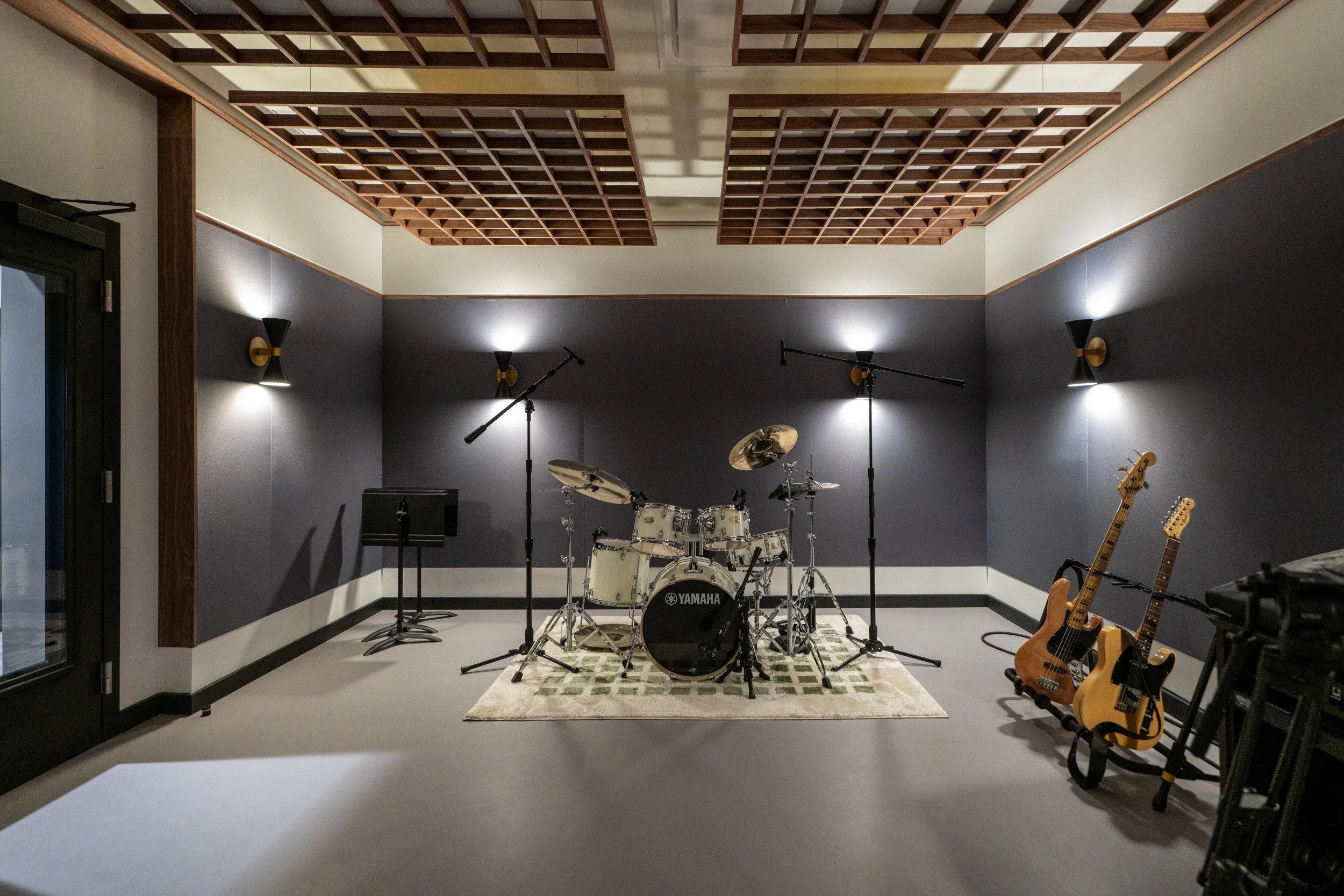 Rehearsal room with drum kit and PA