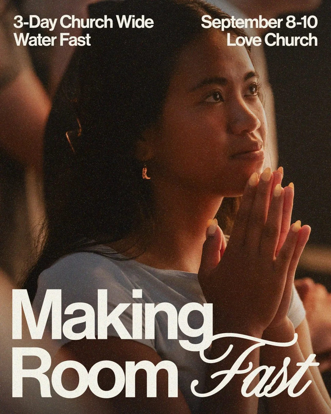 A woman praying during a Love Church gathering